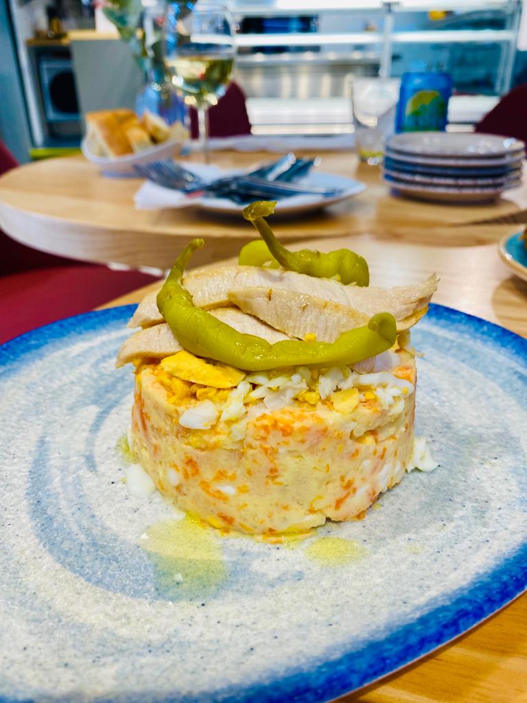 Potato salad with vegetables, mayonnaise, egg, tuna belly and pickles